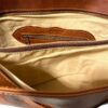 Close up image of a brown bag with open chain zip