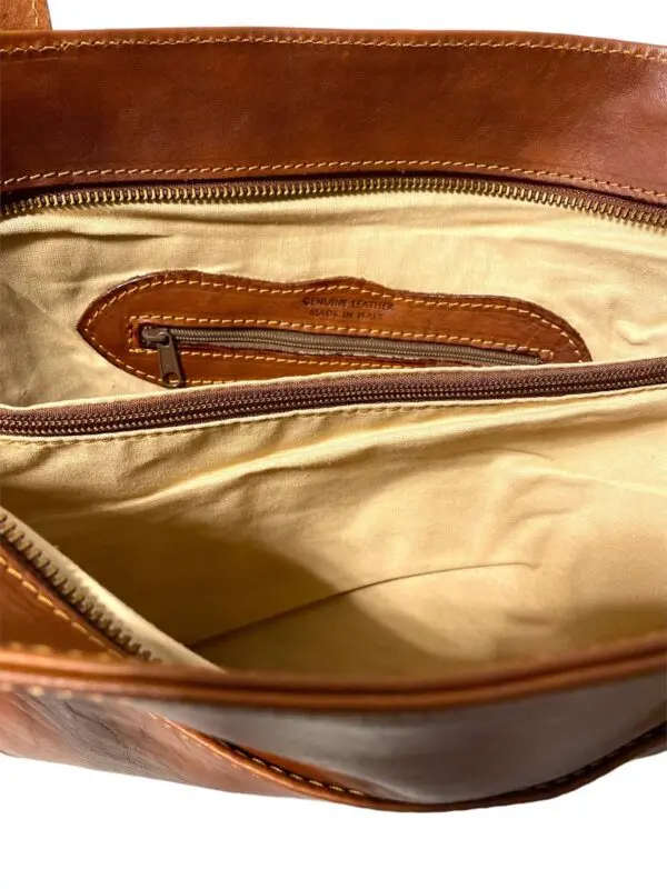 Close up image of a brown bag with open chain zip